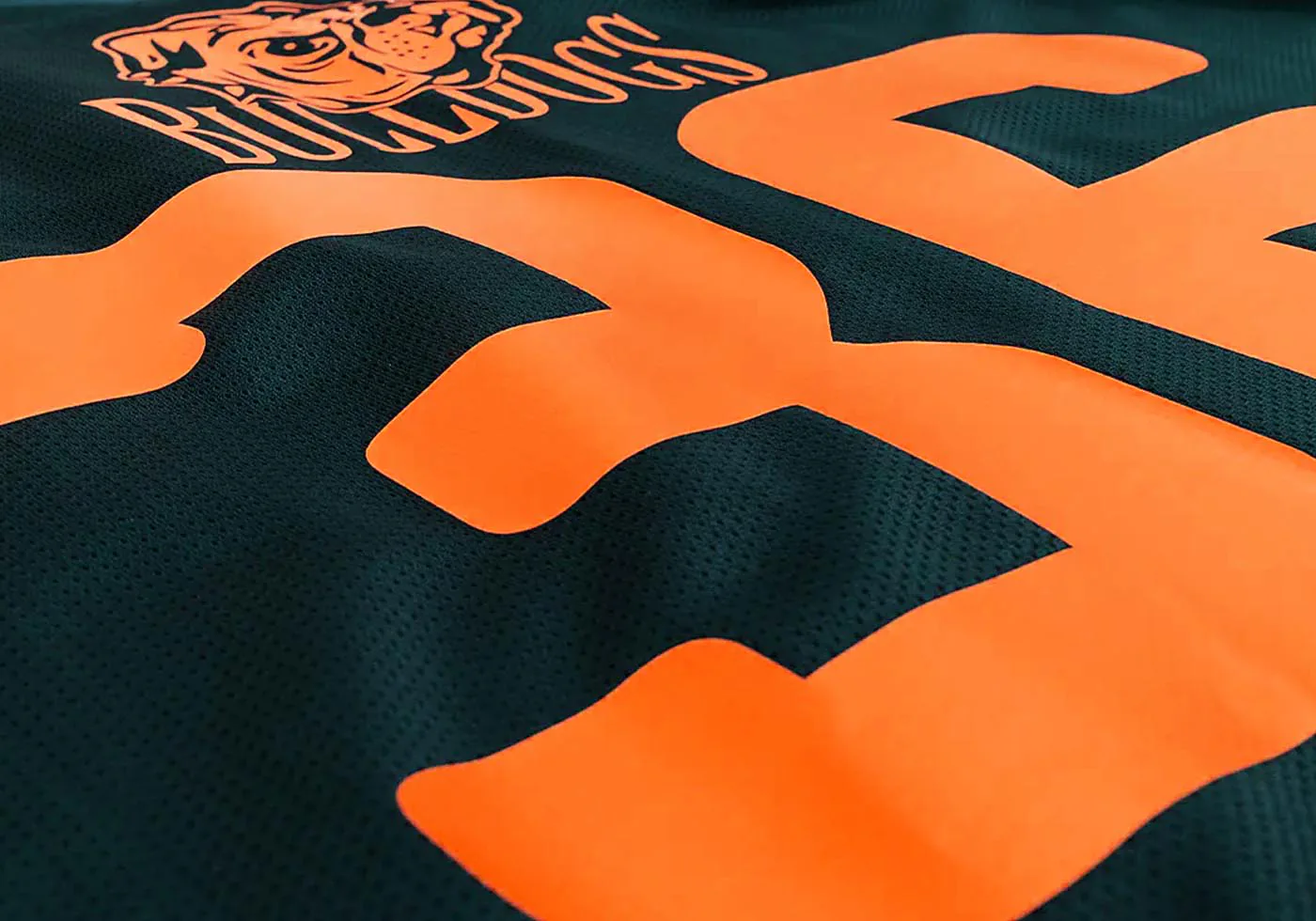 Custom athletic jersey with screen-printed team logo and player number in bold orange, perfect for team uniforms.