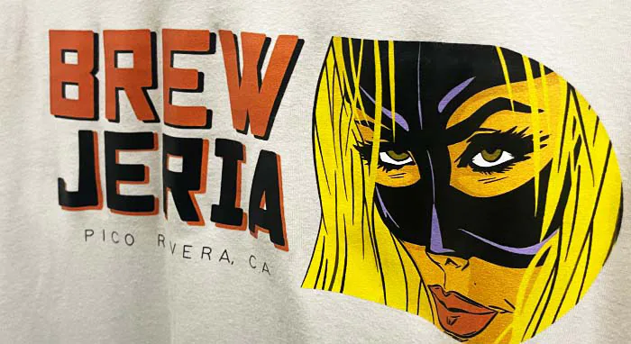 Custom screenprinted t-shirt with vibrant pop art design showcasing high-quality apparel by a Los Angeles screenprinting manufacturer – Custom Apparel, Screenprinting, and Embroidery.